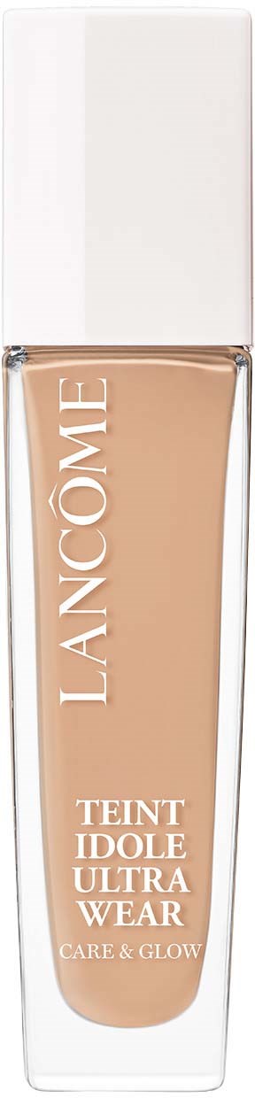 A bottle of Lancôme Teint Idole Ultra Wear foundation with a white cap. The bottle is transparent, showing beige makeup inside.