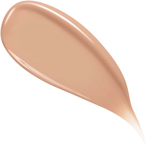 A drop-shaped smear of beige makeup product, smooth and shiny, on a white background.
