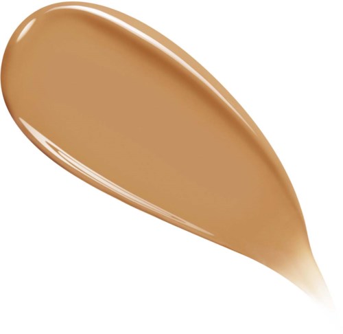 A smooth, elongated drop of beige-colored liquid, with a shiny appearance and a rounded tip.
