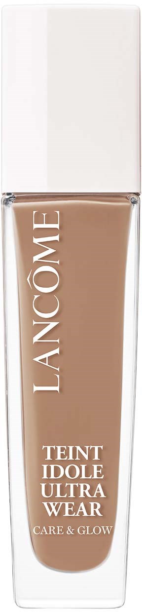 A bottle of Lancôme Teint Idole Ultra Wear foundation with a white cap, beige liquid inside, and brand name on the front.