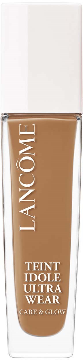 A bottle of Lancôme foundation labeled 'Teint Idole Ultra Wear, Care & Glow' with a white cap.