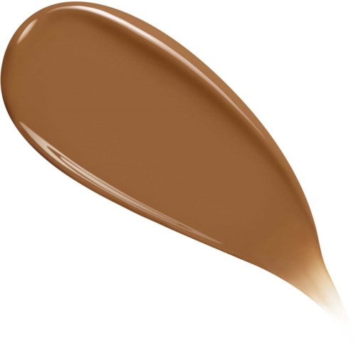 A spoon with a large amount of creamy chocolate spread on it.