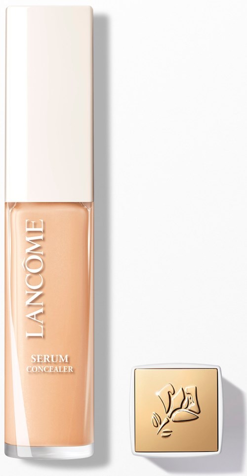 A bottle of Lancôme serum concealer with a cap beside it. The bottle is beige and white, with text on it.