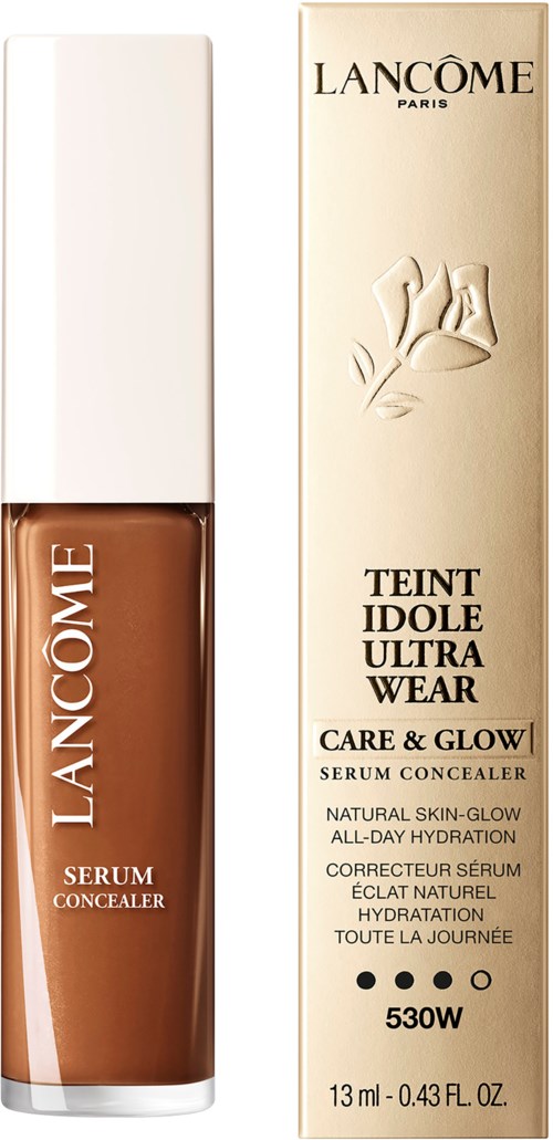 A Lancôme serum concealer product and its packaging box, both featuring elegant beige and brown tones.