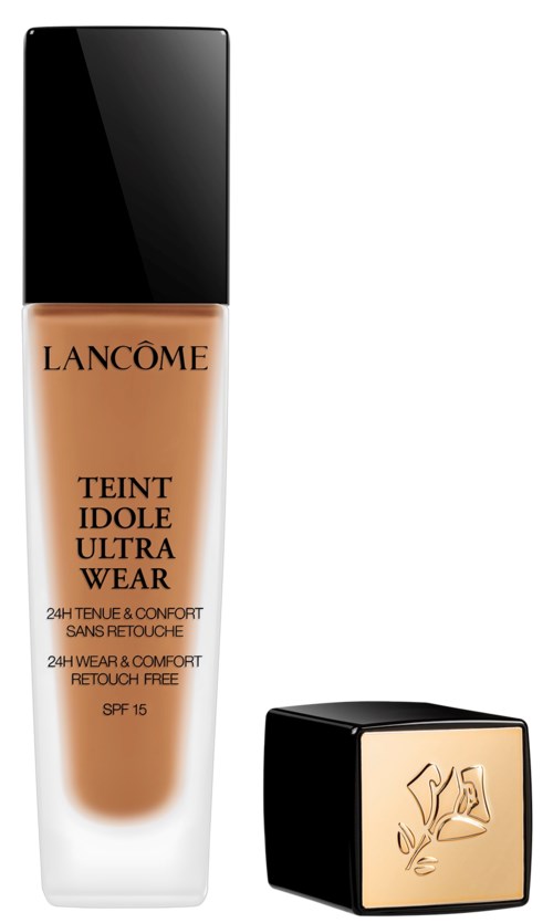 En foundationflaska med svart lock, märkt Lancôme Teint Idole Ultra Wear, SPF 15, 24-timmars hållbarhet, retusjfritt.