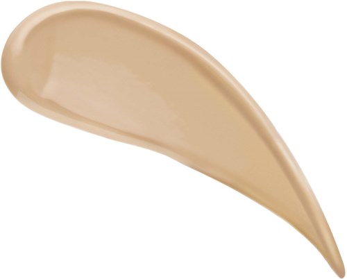 En dropformad klutt av beige kräm eller sås på en vit bakgrund.