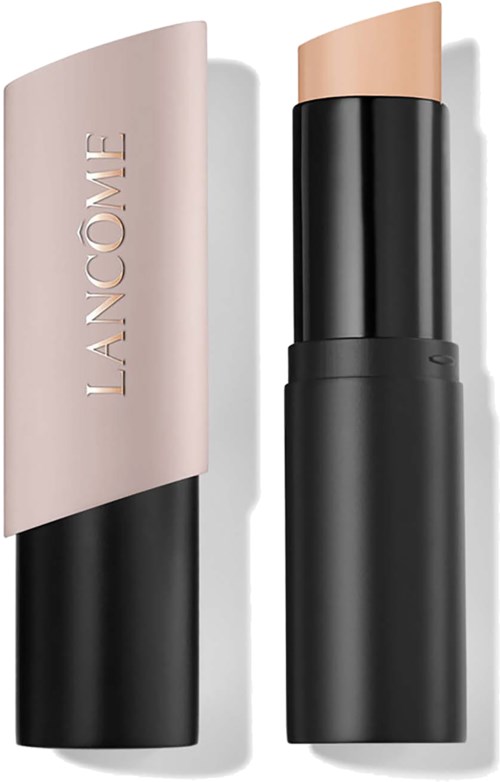 A beige lipstick with a black base and a cover marked Lancome lying open.