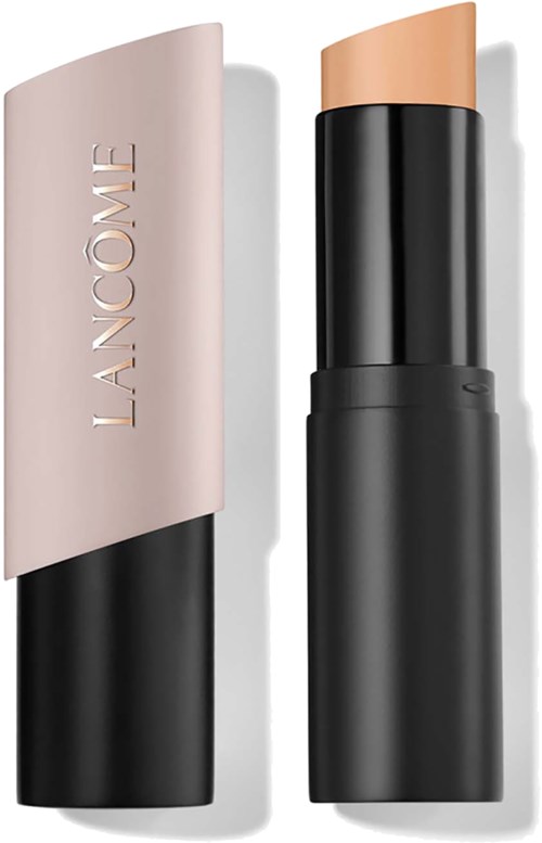 A beige lipstick with a black base and a matching beige cap, branded LANCÔME, standing upright.