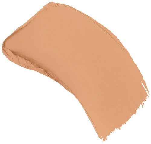 A beige makeup foundation swatch with a curved shape and uneven edges.