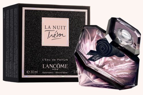 A perfume bottle with a black and pink design, and a black box with text for La Nuit Trésor.