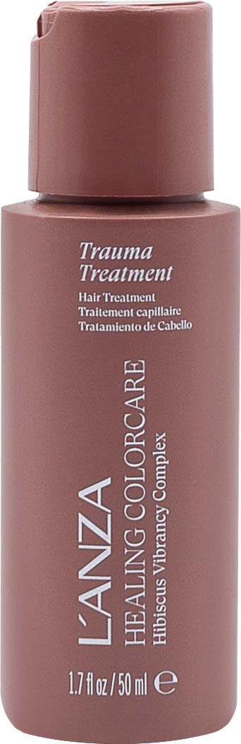 En rosa flaska märkt 'Trauma Treatment' och 'Healing Colorcare Hibiscus Vanilla Complex' för hårvård.