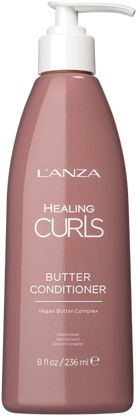 Een roze fles met pomp gemarkeerd L'ANZA Healing Curls Butter Conditioner, 8 fl oz. Voor krullend haar.