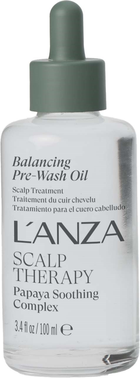 En klar glassflaske med grå dråpetapp, inneholder Balancing Pre-Wash Oil for hodebunnsterapi med papaya beroligende kompleks.