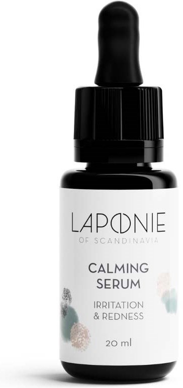 A small black and white bottle with a dropper cap. The label says it is a calming serum for skin.