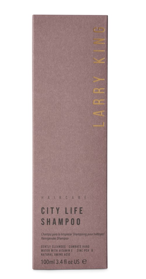 Rosa Shampoo-Box mit goldener und schwarzer Schrift, gekennzeichnet 'Larry King' und 'City Life Shampoo', 100ml.