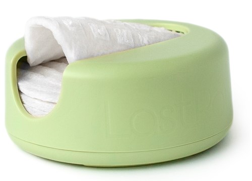 A green tissue box with tissues partially pulled out from it.