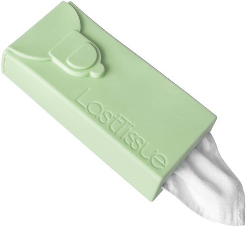 Ein grüner Seifenblock mit kleinem Kreis und dem Wort "Lacticise" geprägt. Etwas Seife ist an Ende sichtbar.