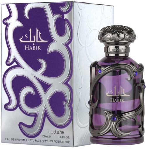 A purple perfume bottle wrapped in black bands, with a decorative lid, next to a matching box with white patterns.