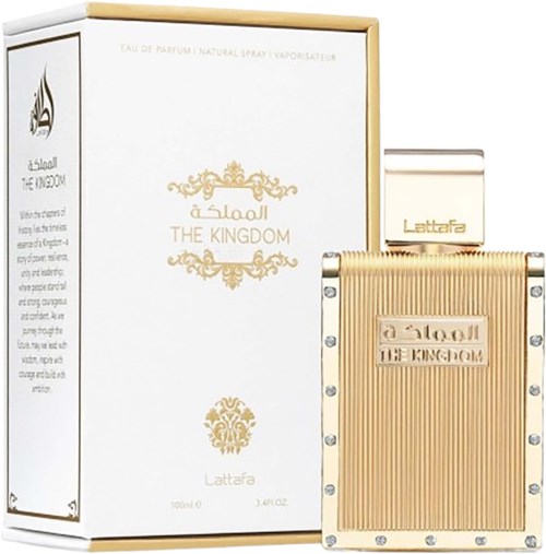 A perfume bottle and box labeled 'The Kingdom' with gold detailing and silver dots. Simple and elegant design.