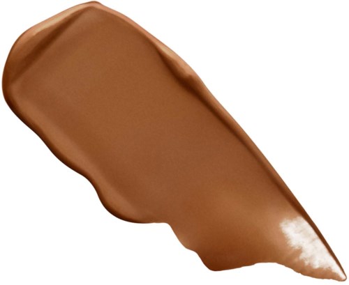 En brun smeta med spetsig spets, som liknar en klick choklad eller färg på vit bakgrund.