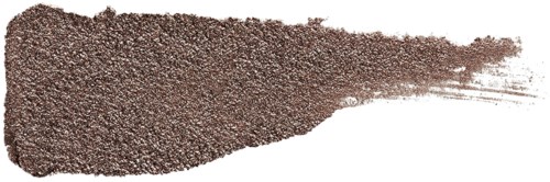 En rand av brunt pulver sprider sig från ett behållare, smalnar av till höger, på en vit bakgrund.