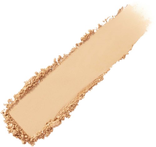 En beige sminkstav med en smulig puderkant och en slät yta.