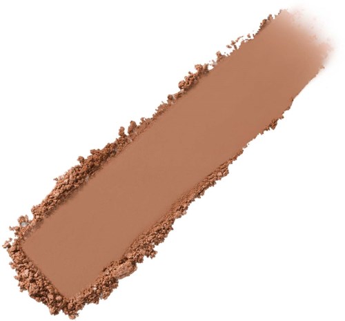 En provbit med beige-färgad pulver med oregelbundna kanter, troligtvis makeup eller kosmetiskt material.
