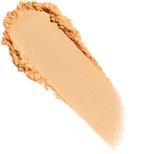 Et beige pulver spredt i en halvsirkel med en mørk kant, sannsynligvis en kosmetisk eller makeup produkt.