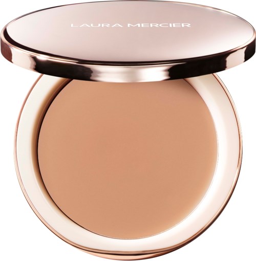 A compact of Laura Mercier face powder with a rose gold casing and the lid open.