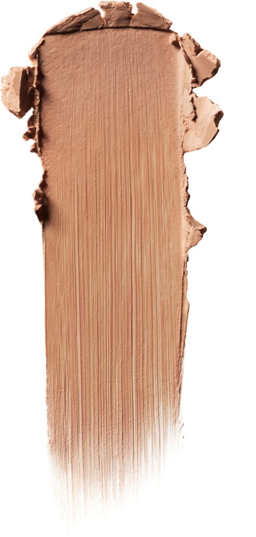 A smear of beige makeup foundation on a white background shows texture and color.