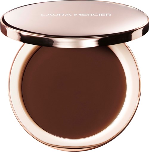 A round compact with a metallic pink cover containing dark brown pressed powder. Laura Mercier is written on top.