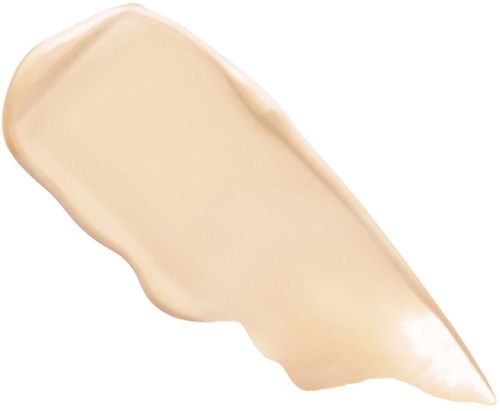 En beigefärgad kräm eller lotion med slät, tjock textur och långsträckt form.