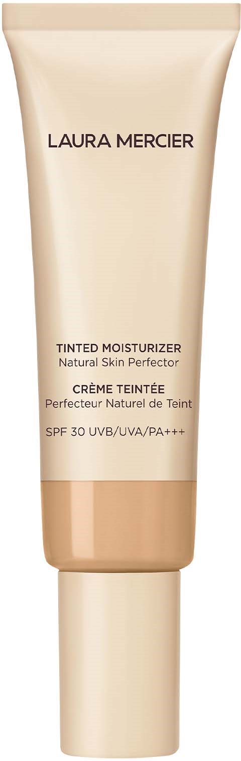 En beige tube med Laura Mercier tinted moisturiser med SPF 30, märkt som naturlig och hudförbättrande.