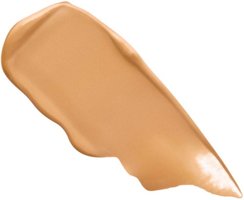 Ett beige eller ljusbrunt krämigt pålägg med slät textur och en skedform.