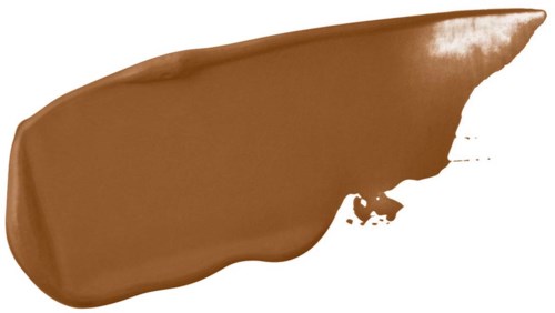 Ruskea ruskeaa nestettä, todennäköisesti meikkituotetta, valkoisella pinnalla epätasaisilla reunoilla.