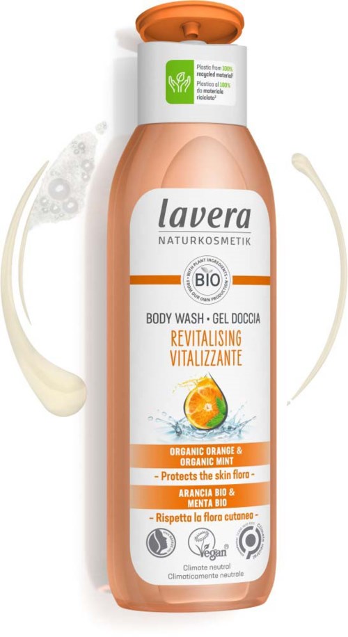 A bottle of Lavera organic body wash with orange scent, showing health labels, green certification, and illustrations of orange and cream.