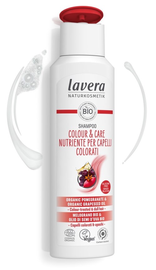 A white shampoo bottle with red cap, contains organic pomegranate and grapefruit oil, suitable for colored and damaged hair.