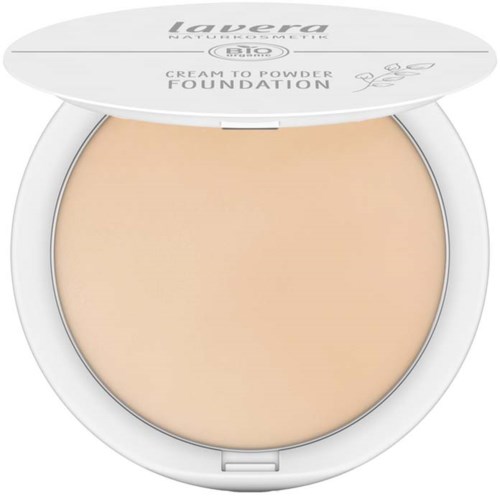 A compact of Laura Mercier foundation with beige powder inside and a white lid with text.