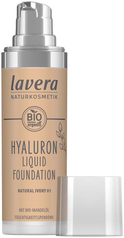 A beige bottle with a pump, labeled Lavera BIO hyaluronic liquid foundation, and a clear cap beside it.