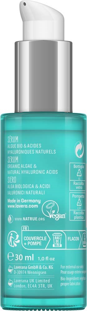 A blue-green serum bottle with a silver pump cap and white text on the label.