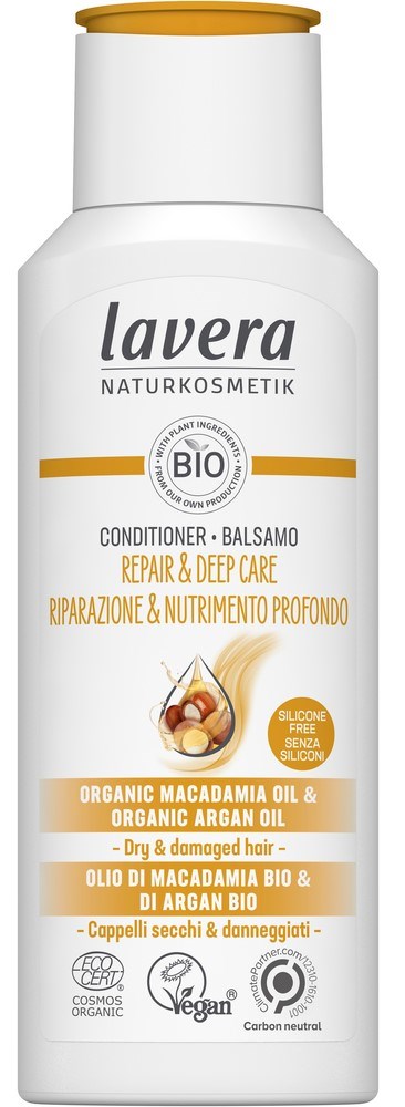 A white bottle with a gold cap, labeled for hair conditioner made with organic oils, suitable for dry, damaged hair.