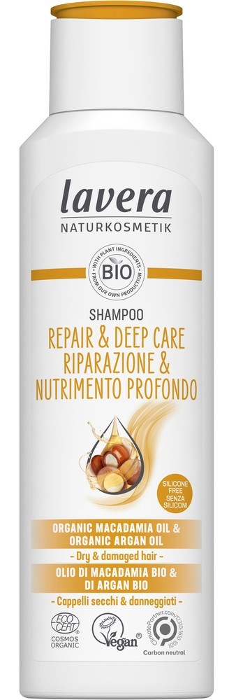 A white shampoo bottle labeled 'Lavera' with natural and organic ingredients, focused on repair and deep care for dry hair.