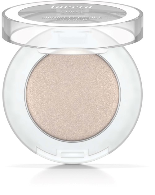 A round, clear makeup compact with a beige pressed powder inside and a transparent lid.