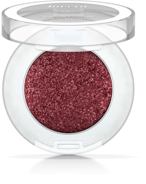Ett runt makeup-objekt med röd, glittrig ögonskugga inuti och ett genomskinligt plastlock.