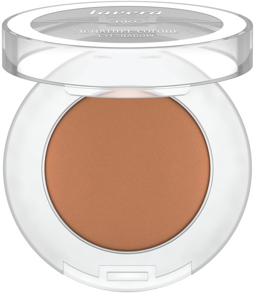 A compact of powder foundation with a clear lid, labeled 'Lavera,' inside a white case.