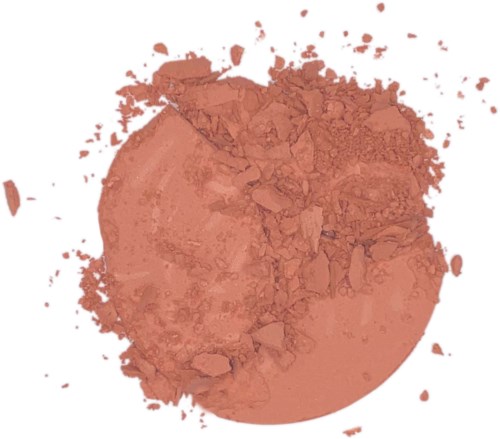 A round, dusty orange powder spilled with scattered smaller pieces around it.