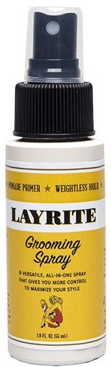 A small white bottle with a black spray nozzle, labeled 'Layrite Grooming Spray' in yellow and black text.