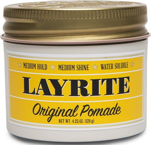 A white jar with a gold lid and a yellow label that says Layrite Original Pomade for hair styling.