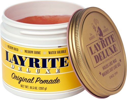 A yellow container of Layrite Deluxe Original Pomade with a gold lid, showing pinkish hair gel inside.