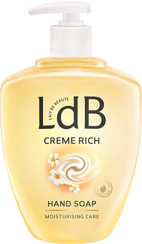 Eine gelbe Flasche Handseife mit Aufschrift 'LdB Creme Rich', mit Blumen und Pumpkopf.